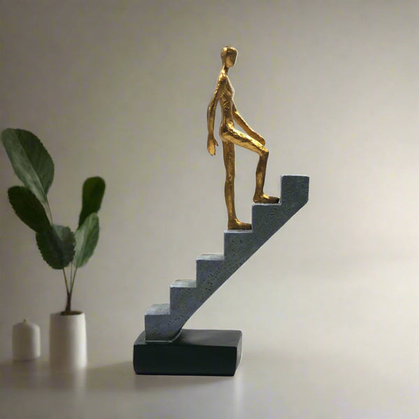 Resin Man Walking Up Stairs